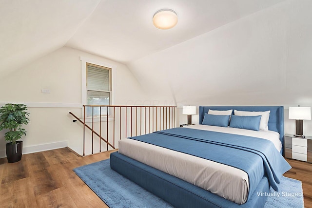 1361 City Park Ave, Columbus, OH 43207 - bedroom with lofted ceiling and wood finished floors
