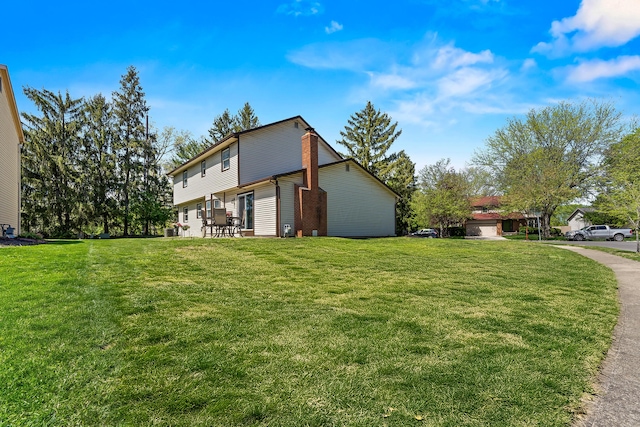 view of home's exterior with a lawn