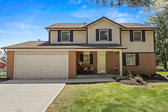 traditional home with covered porch, a front yard, brick siding, a shingled roof, and concrete driveway