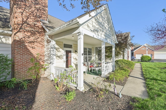 view of front of house with a porch, brick siding, and a shingled roof