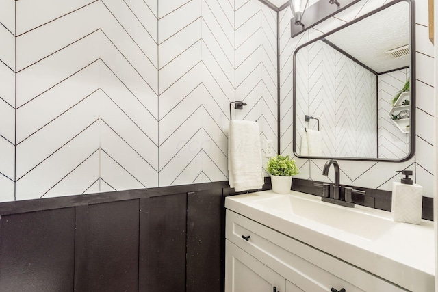 bathroom with vanity and visible vents