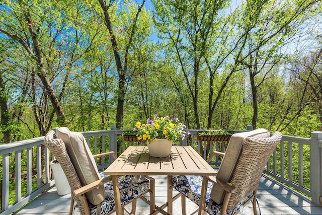 wooden deck with outdoor dining space