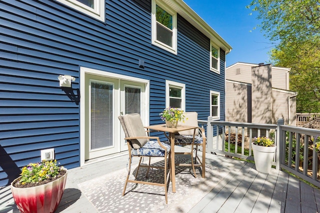 wooden deck with outdoor dining space