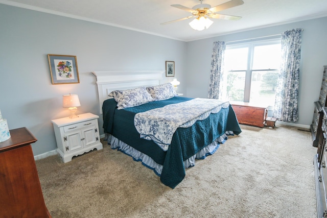 bedroom with baseboards, ceiling fan, crown molding, and carpet floors
