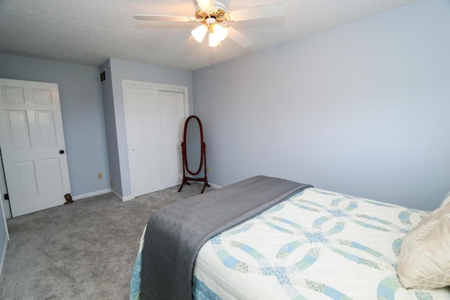 bedroom with a closet, carpet, visible vents, ceiling fan, and baseboards