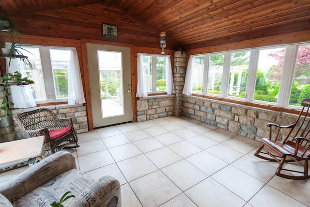 sunroom / solarium with tile patterned floors and lofted ceiling