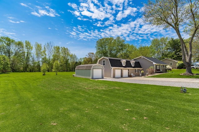 view of yard featuring an outbuilding and driveway
