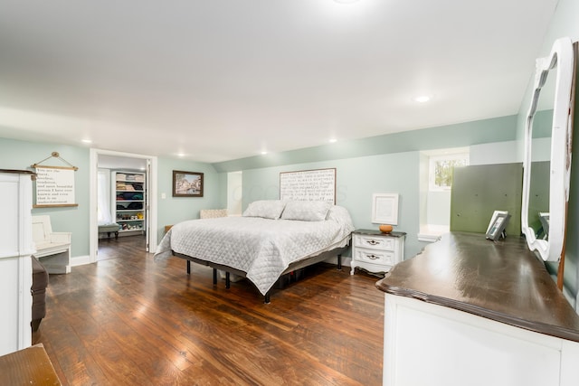 bedroom featuring recessed lighting, baseboards, and dark wood finished floors