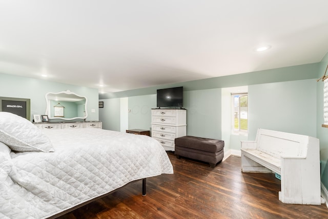 bedroom with recessed lighting and wood finished floors