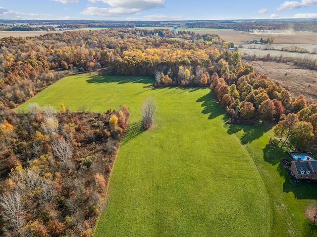 birds eye view of property with a rural view