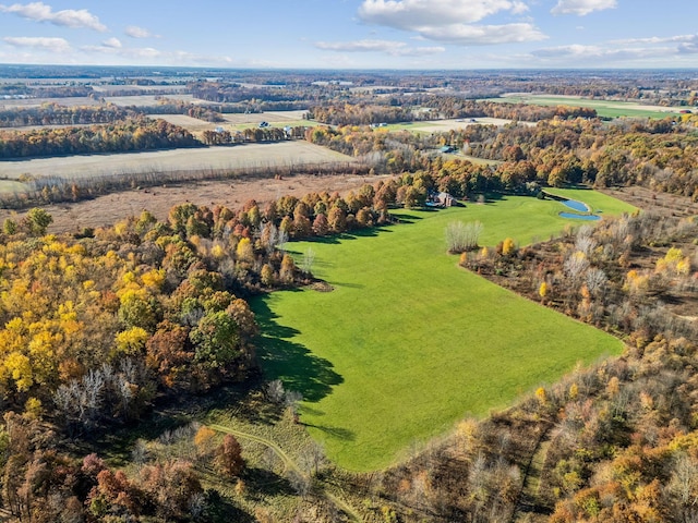 birds eye view of property with a rural view