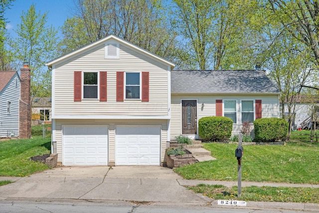split level home featuring an attached garage, driveway, a shingled roof, and a front lawn