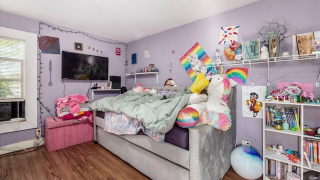 bedroom with wood finished floors
