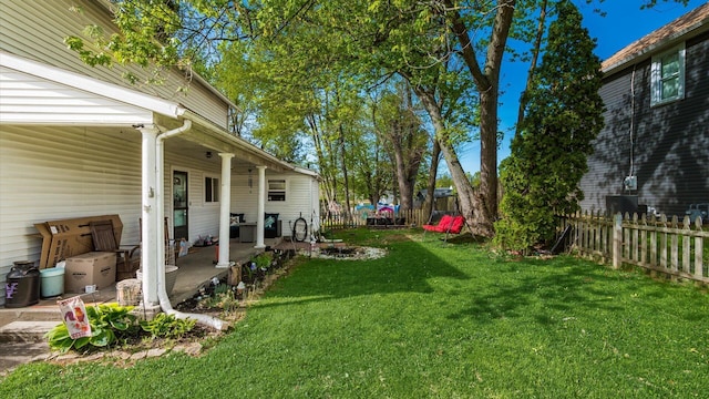 view of yard with a fenced backyard and a patio area