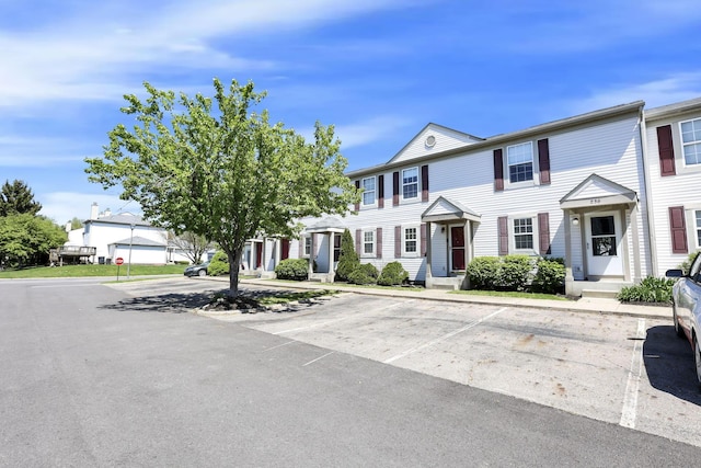 view of property with uncovered parking