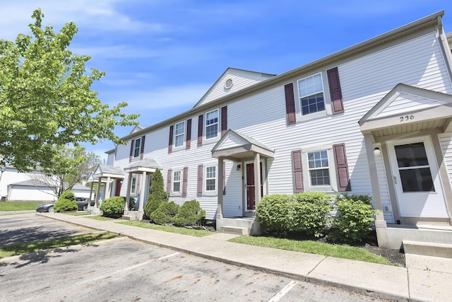 multi unit property featuring uncovered parking