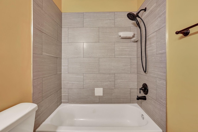bathroom with toilet and  shower combination