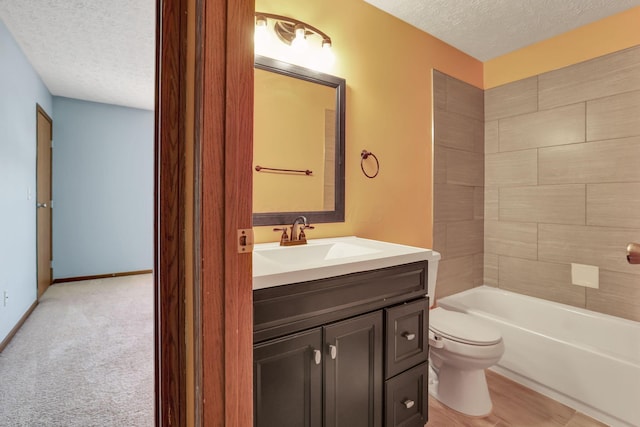 full bath with shower / bathtub combination, toilet, a textured ceiling, and vanity