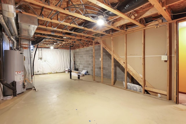 unfinished below grade area featuring gas water heater