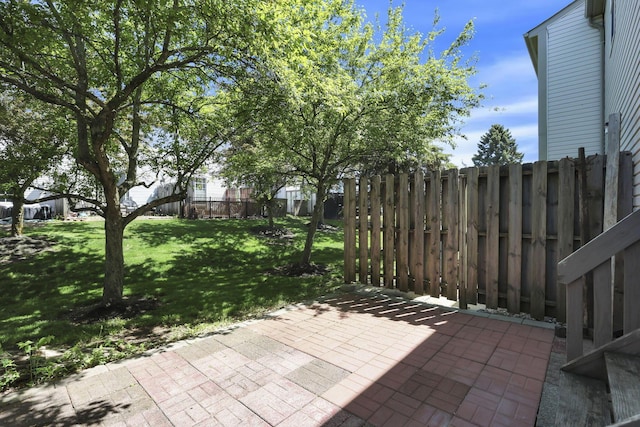 view of patio / terrace featuring fence