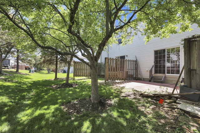 view of yard featuring a patio and fence