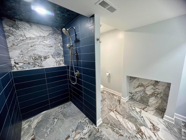 357 Carroll Eastern Rd NW, Baltimore, OH 43105 - bathroom with toilet, a tile shower, visible vents, baseboards, and marble finish floor
