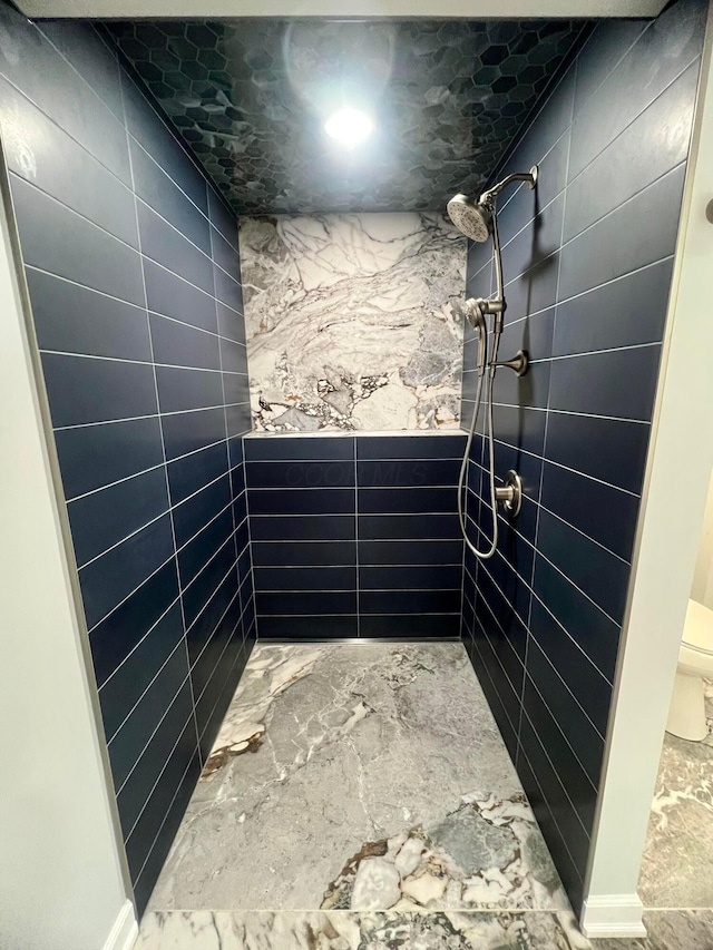 357 Carroll Eastern Rd NW, Baltimore, OH 43105 - bathroom featuring toilet and a tile shower