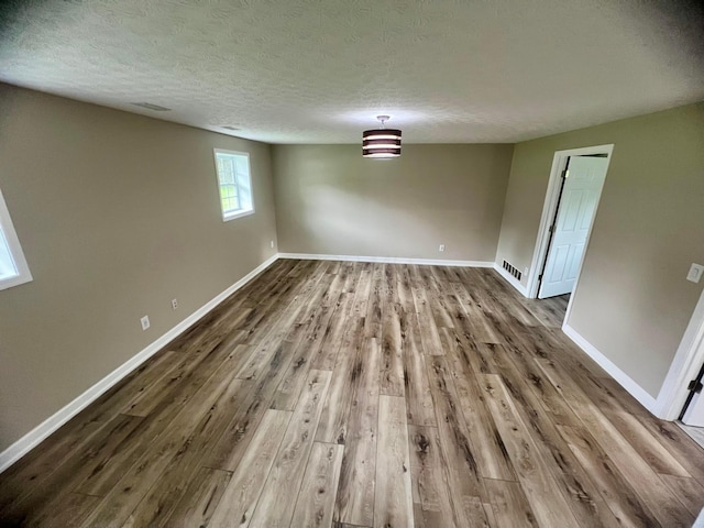 357 Carroll Eastern Rd NW, Baltimore, OH 43105 - unfurnished dining area featuring a textured ceiling and dark wood-style flooring
