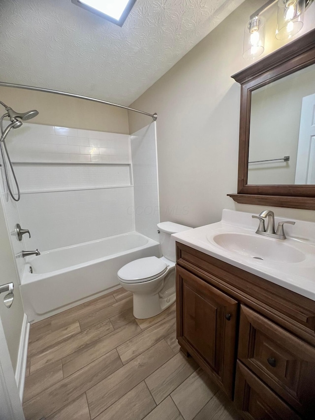 357 Carroll Eastern Rd NW, Baltimore, OH 43105 - bathroom featuring a textured ceiling, toilet, shower / tub combination, vanity, and wood finished floors