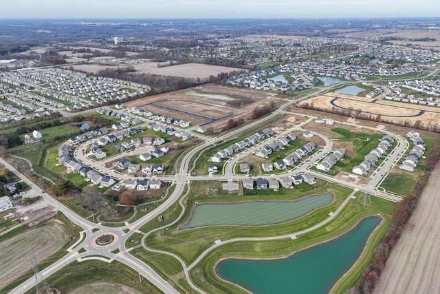 birds eye view of property featuring a water view and a residential view