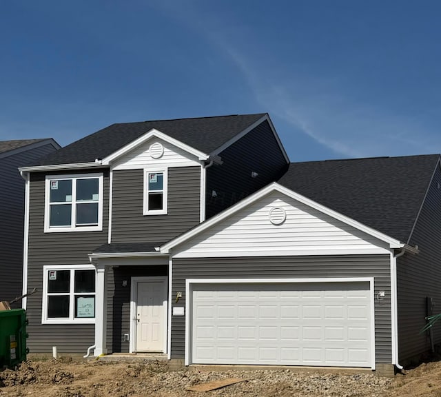 121 Reneau Ave Lot 33, Galloway, OH 43119 - traditional home with driveway, an attached garage, and roof with shingles