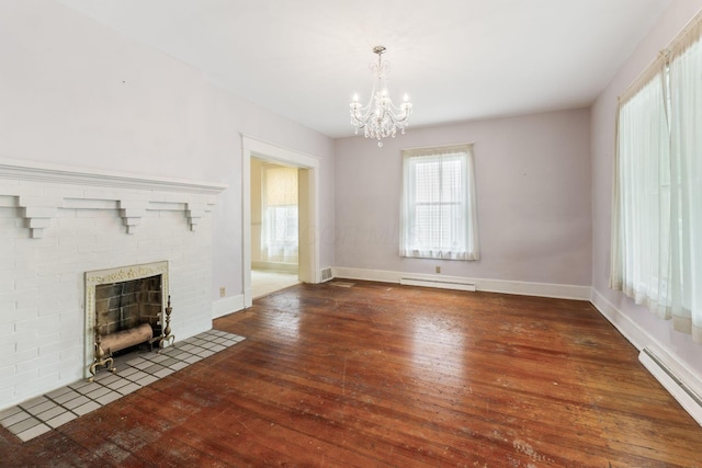 22 Elizabeth St, Delaware, OH 43015 - unfurnished living room with a fireplace, hardwood / wood-style flooring, baseboards, a baseboard heating unit, and a notable chandelier