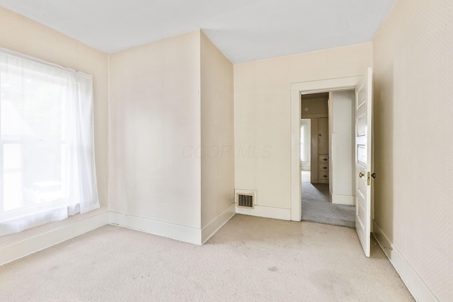 22 Elizabeth St, Delaware, OH 43015 - spare room with visible vents, baseboards, and light colored carpet