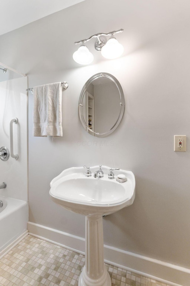 22 Elizabeth St, Delaware, OH 43015 - bathroom featuring baseboards, shower / tub combination, and tile patterned floors