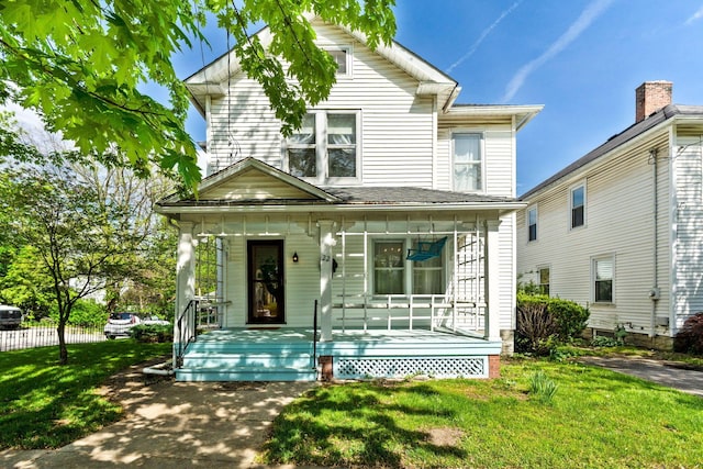 22 Elizabeth St, Delaware, OH 43015 - view of front of property with covered porch and a front lawn