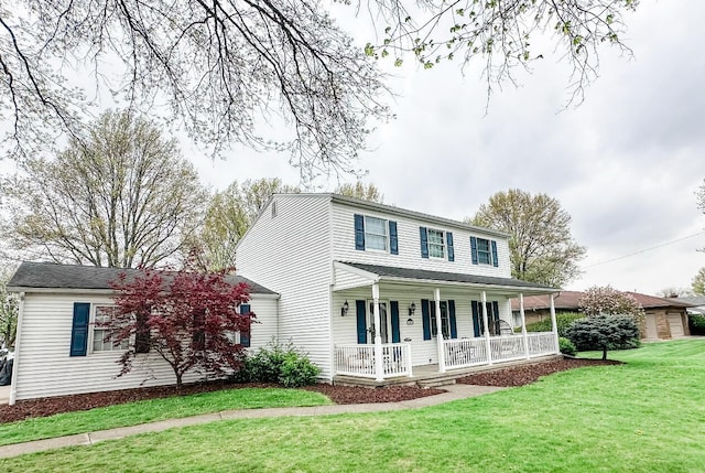 view of front of property with a porch and a front yard