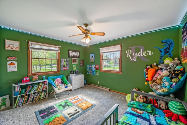 1083 Martha Ave, Bucyrus, OH 44820 - playroom with carpet floors, a ceiling fan, baseboards, and a baseboard heating unit