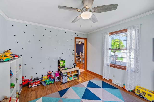 1083 Martha Ave, Bucyrus, OH 44820 - game room featuring a ceiling fan, visible vents, wood finished floors, baseboards, and ornamental molding