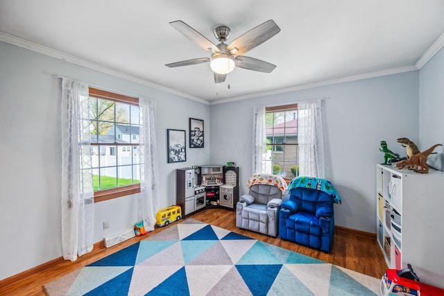 1083 Martha Ave, Bucyrus, OH 44820 - rec room featuring crown molding, visible vents, wood finished floors, and a wealth of natural light