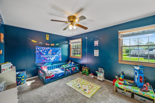 1083 Martha Ave, Bucyrus, OH 44820 - recreation room with baseboards, a ceiling fan, and carpet flooring