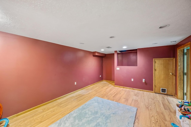 1083 Martha Ave, Bucyrus, OH 44820 - empty room featuring recessed lighting, baseboards, light wood-type flooring, and a textured ceiling