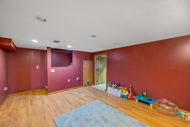 1083 Martha Ave, Bucyrus, OH 44820 - playroom featuring visible vents, recessed lighting, baseboards, and wood finished floors