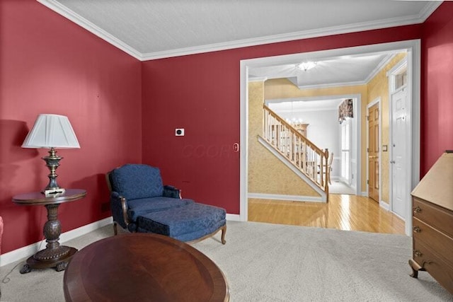 living area with an inviting chandelier, carpet, stairs, baseboards, and ornamental molding