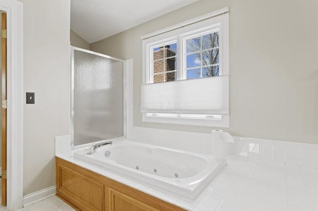 full bath featuring a whirlpool tub and a stall shower