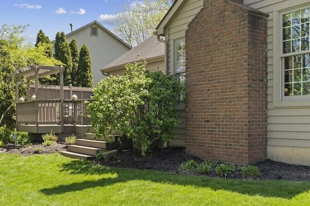 view of yard featuring fence and a deck