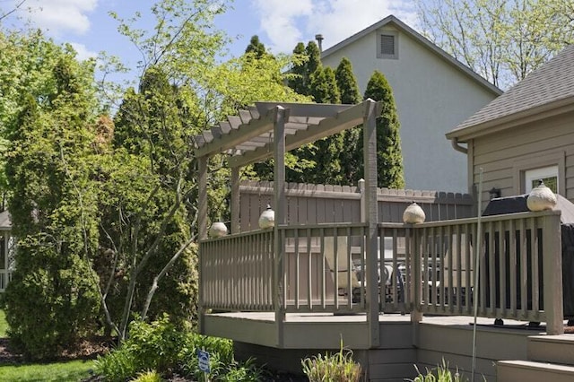 wooden deck featuring a pergola