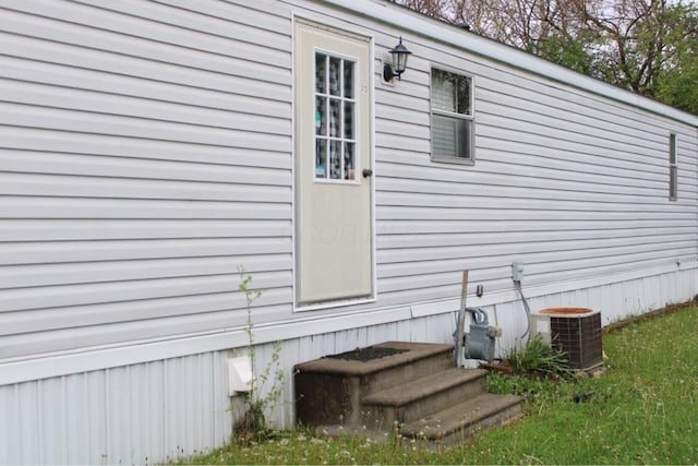 view of side of property featuring cooling unit