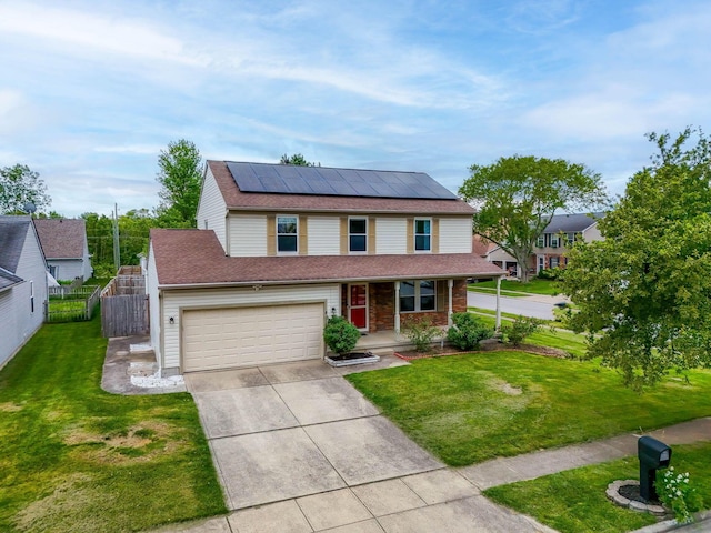 2257 Jarrow Dr, Hilliard, OH 43026 - traditional home featuring a porch, solar panels, driveway, an attached garage, and a shingled roof