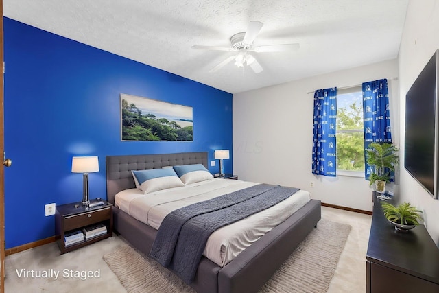2257 Jarrow Dr, Hilliard, OH 43026 - carpeted bedroom with baseboards, a ceiling fan, and a textured ceiling