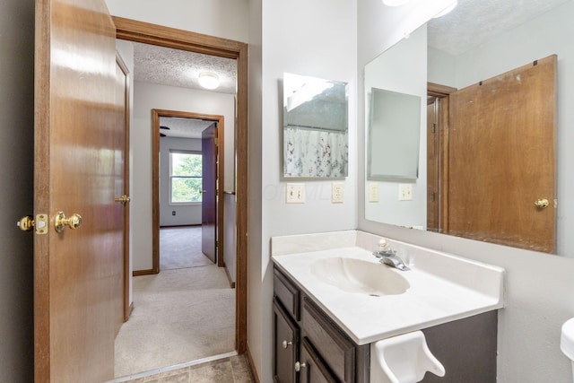 2257 Jarrow Dr, Hilliard, OH 43026 - bathroom featuring a textured ceiling and vanity